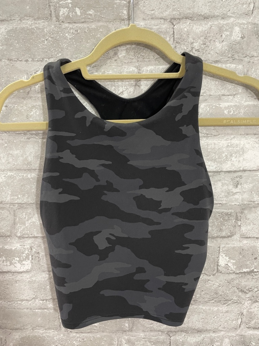 Athleta Conscious Crop Top in a black camouflage print